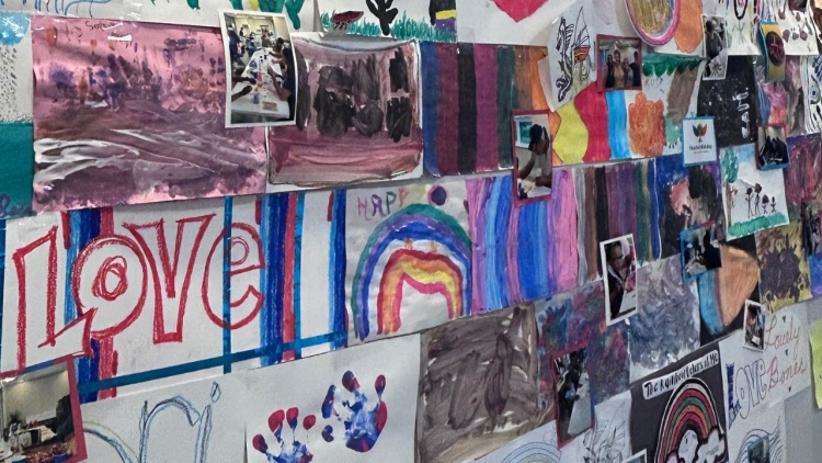A wall of art created by residents at Avenue Square Apartments
